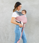 Mother carrying infant in a lightweight breathable 3D mesh ergonomic baby carrier outdoors
