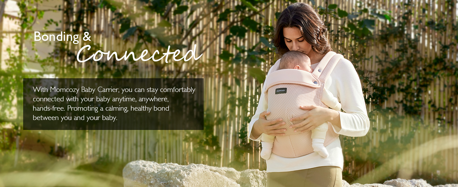 Mother carrying infant in a lightweight breathable 3D mesh ergonomic baby carrier outdoors